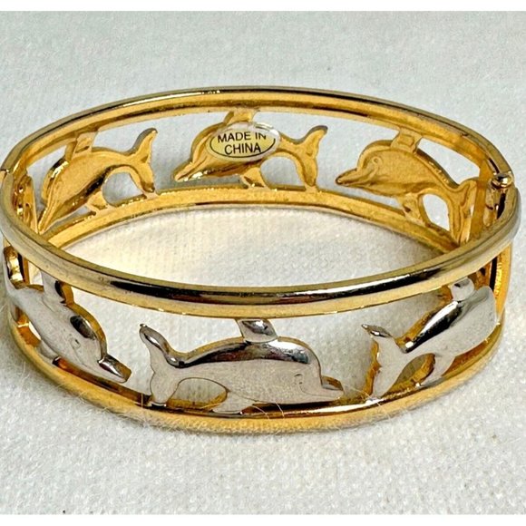 Gold Tone Hinged Bracelet with Silver Tone Smiling Dolphins - Picture 2 of 5